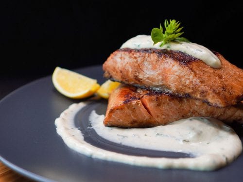 Copycat Outback Steakhouse Grilled Salmon Recipe - grilled salmon brushed with seasoned sauce and served with tartar sauce