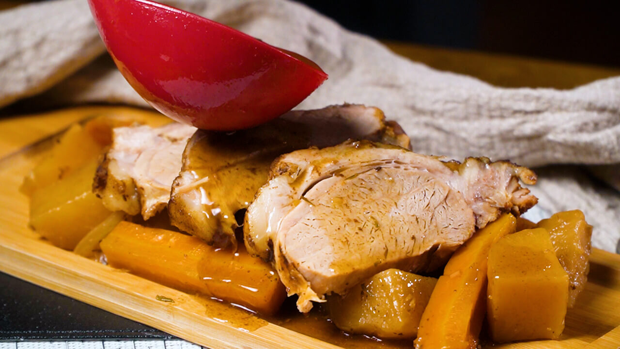 pouring sauce over pork roast and vegetables, crock pot pork roast with potatoes and carrots