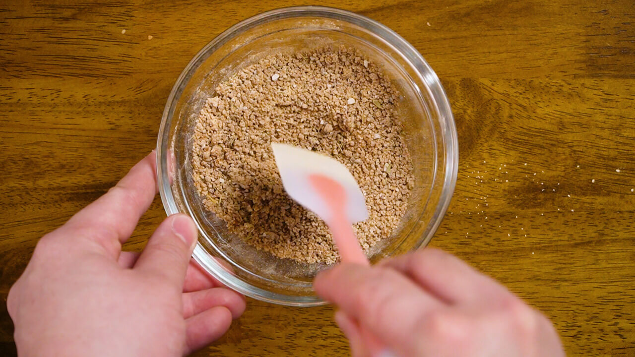 preparing dry rub for crock pot pork roast with potatoes and carrots