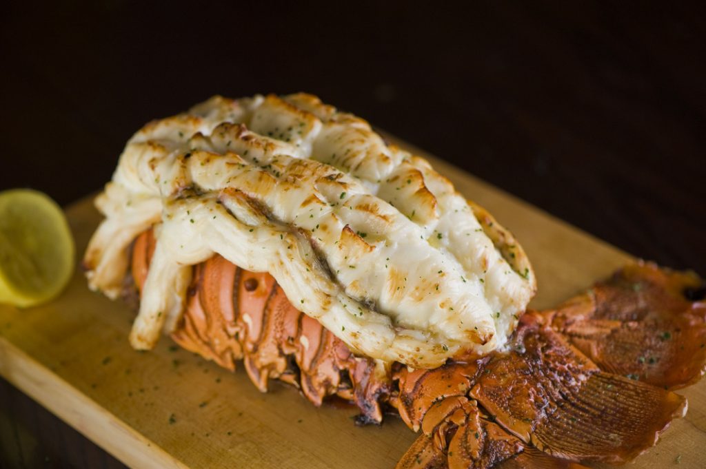 Lobster tail, served with drawn butter and lemon wedges. Maine l