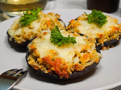 Cheesecake Factory's Stuffed Mushrooms Recipe, homemade stuffed mushrooms topped with mozzarella and parmesan cheese