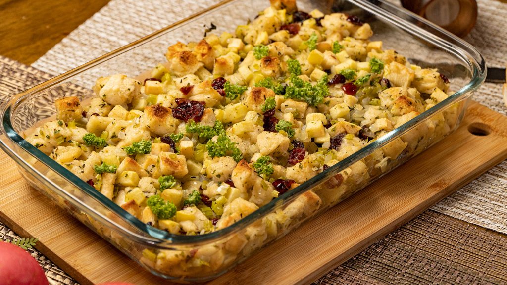 Apple Cranberry Rosemary Stuffing Recipe. Stuffing filled with cranberries, apples, and rosemary; served on a baking casserole