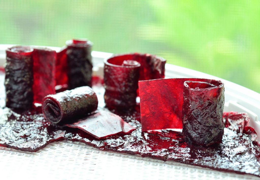 Strips of grape-flavored fruit leather or fruit roll-ups