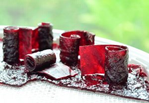 Strips of grape-flavored fruit leather or fruit roll-ups