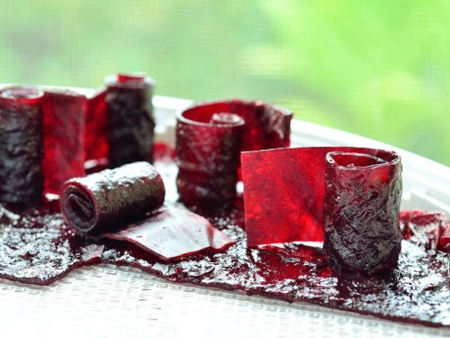 Strips of grape-flavored fruit leather or fruit roll-ups