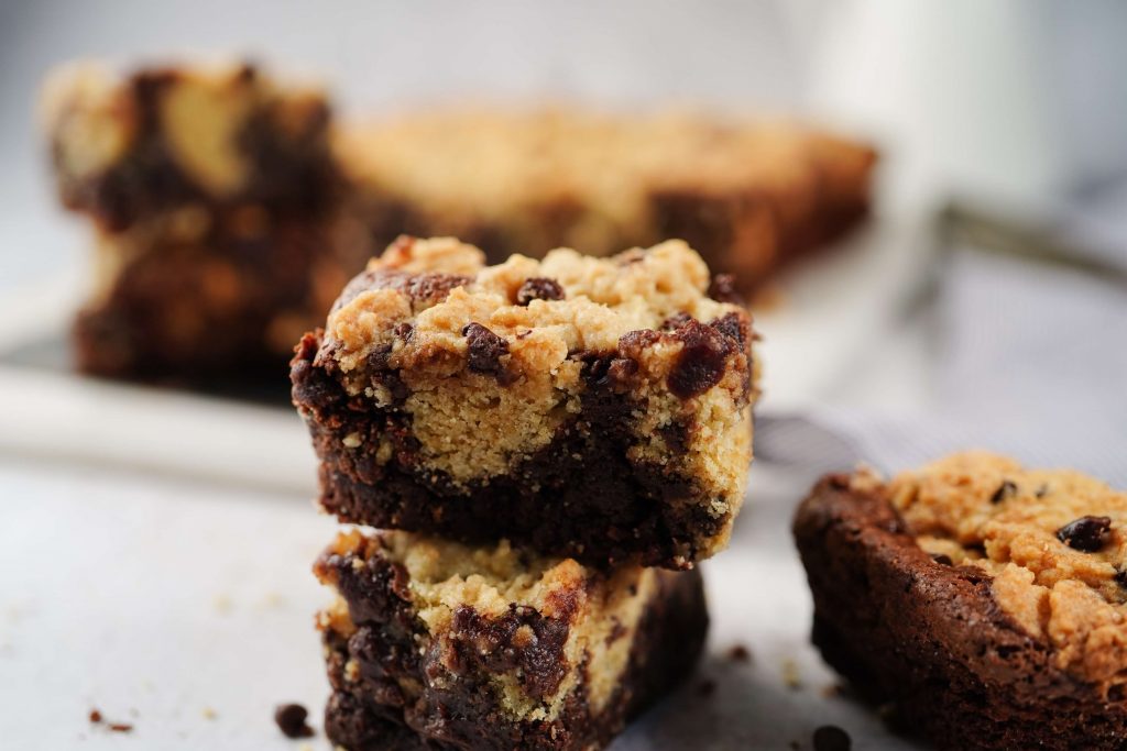 a close up of cookie dough brownies