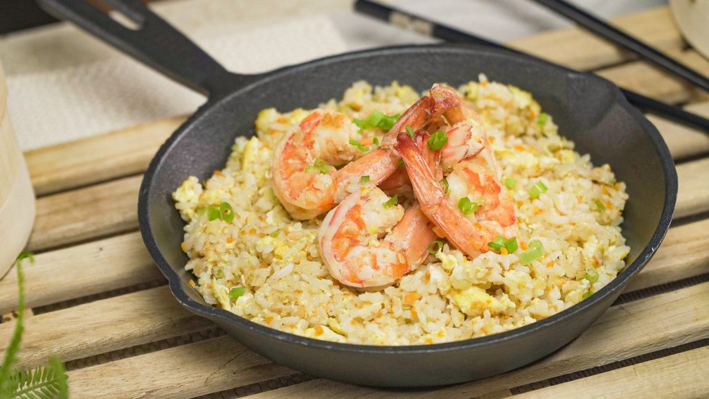 Shrimp Fried Rice Recipe, Fried rice topped with shrimp and served on a cast iron skillet