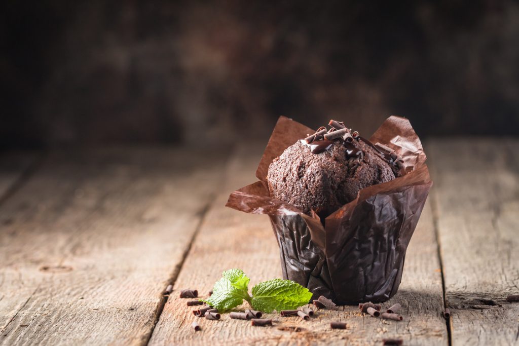 a chocolate muffin with shaved chocolate