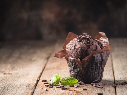 a chocolate muffin with shaved chocolate