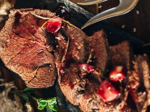 bear meat served on a long black plate