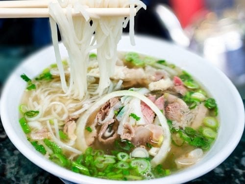 rice noodles and beef tripe in a white bowl