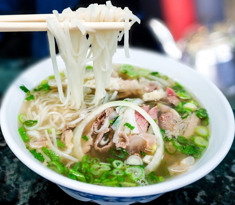 rice noodles and beef tripe in a white bowl