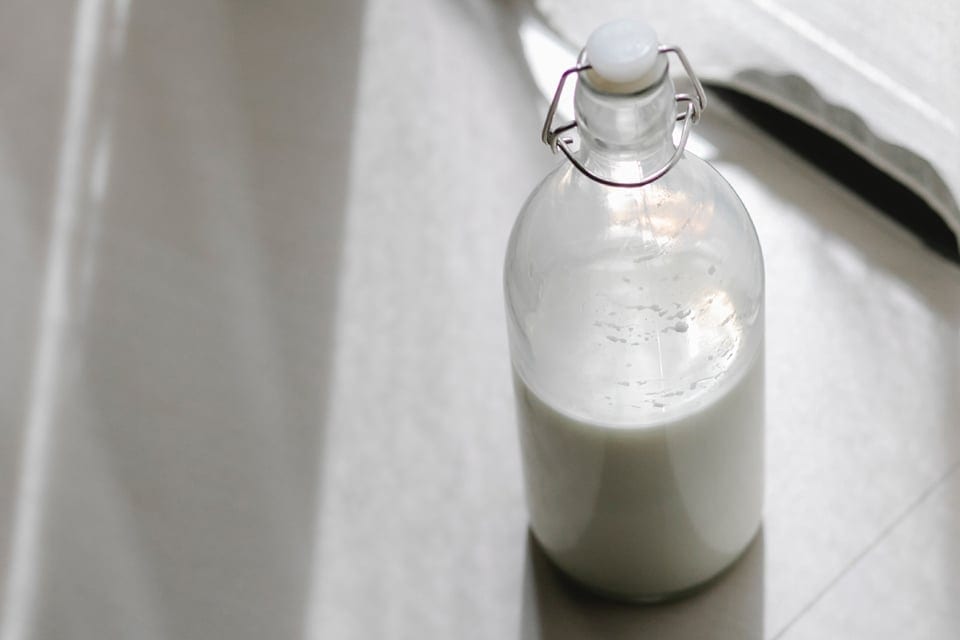 how to make 2-ingredient buttermilk, glass bottle containing buttermilk