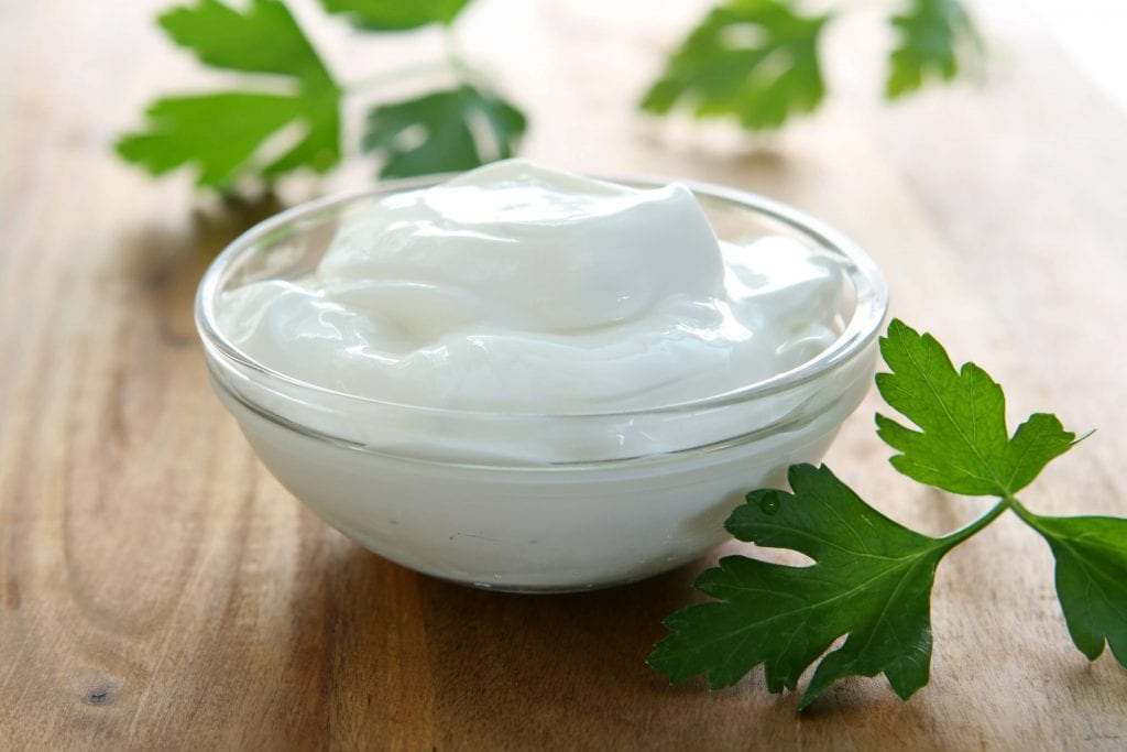 sour cream, sour cream served with leaves on the side