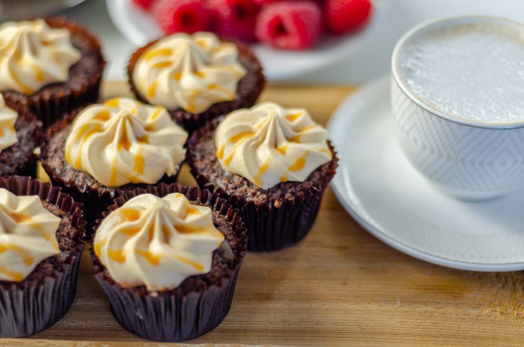 chocolate caramel coconut cupcakes with a cup of coffee