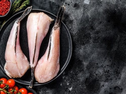 raw monkfish fillet, deboned monkfish on a plate with tail