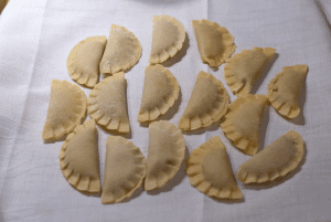 Batch of stuffed mezzelune pasta