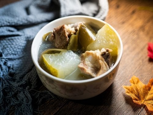 Winter Melon Soup- a small bowl of winter melon, meat, and vegetables in a light broth.