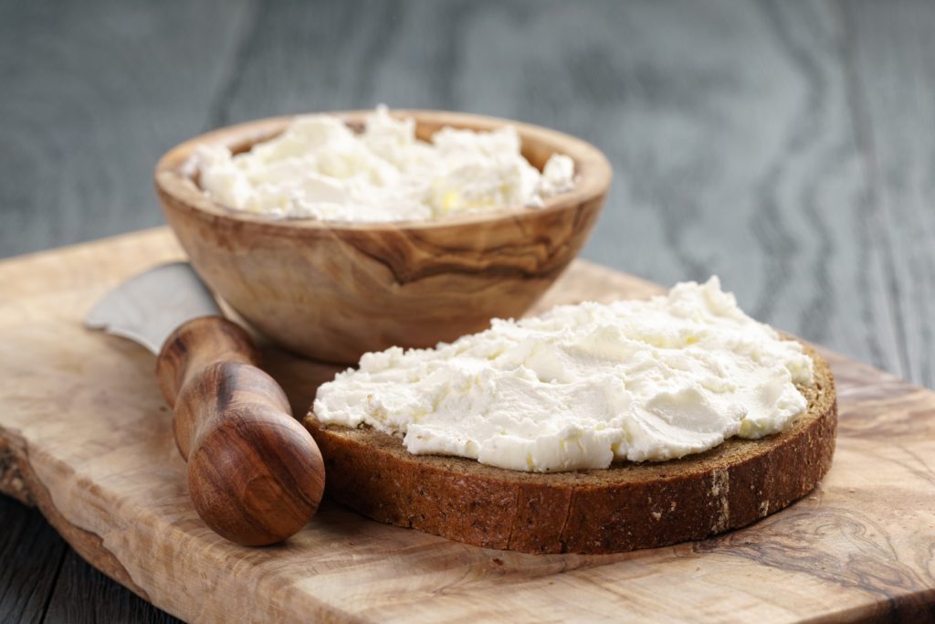 Cream cheese on bread and bowl