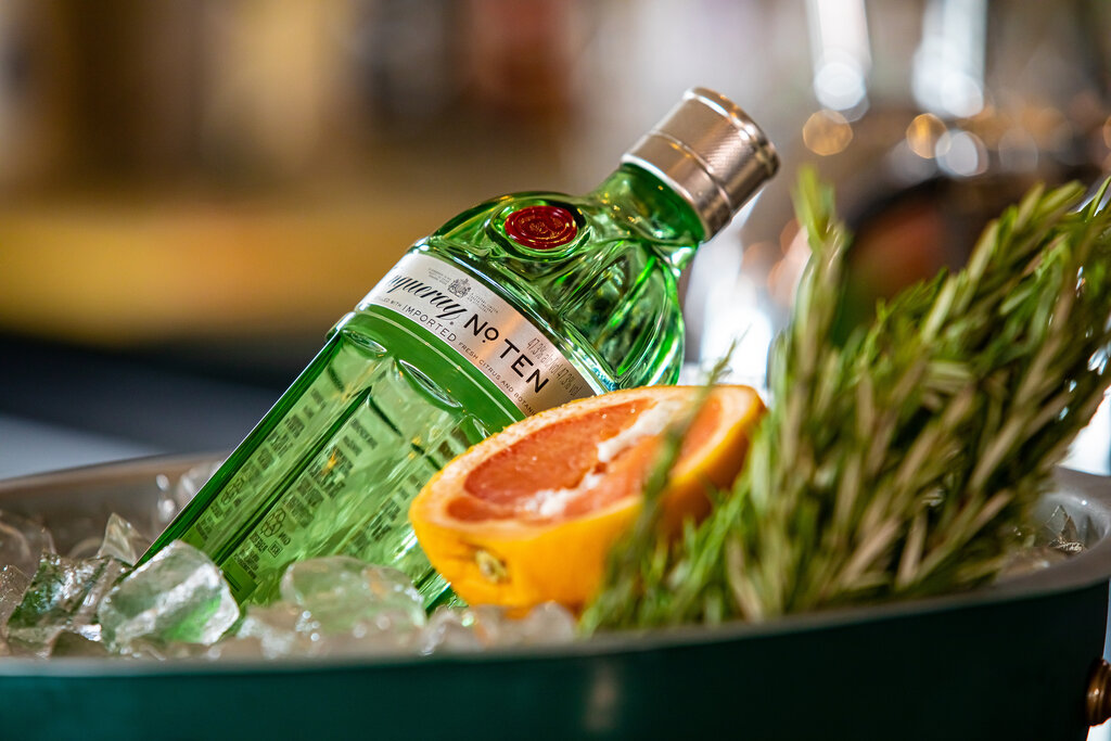 tanqueray gin bottle in an ice bucket