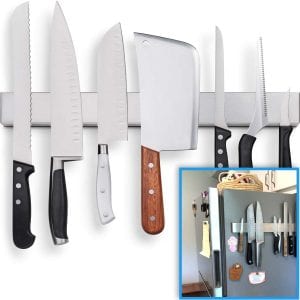 Fridge Applicable 17 Inch Stainless Steel Magnetic Knife Holder, with knives on the side of a refrigerator