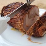 electric knife cutting a ham