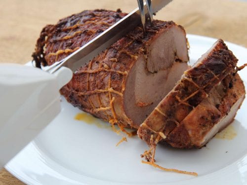 electric knife cutting a ham