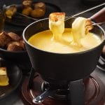 melted cheese fondue with dipping forks