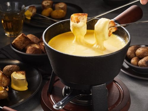 melted cheese fondue with dipping forks