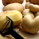 Potato peeler with potatoes
