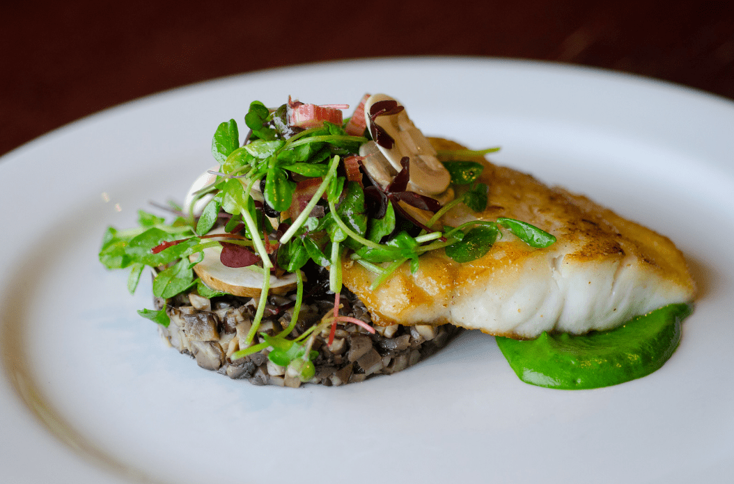 striped bass with an assortment of vegetables