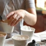 Woman pouring chai tea, a coffee substitute with caffeine