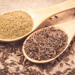Ground and whole cumin on wooden background, Cumin Substitutes