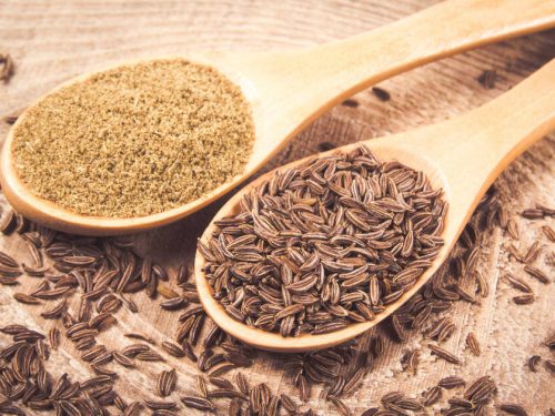Ground and whole cumin on wooden background, Cumin Substitutes
