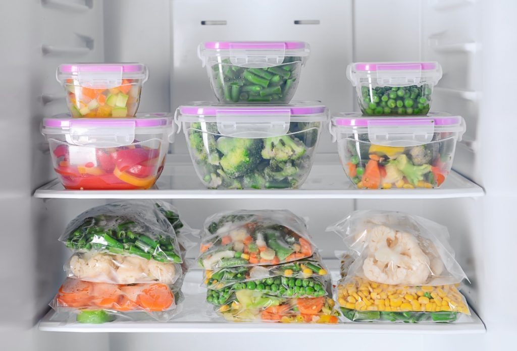 Freezer containers filled with veggies