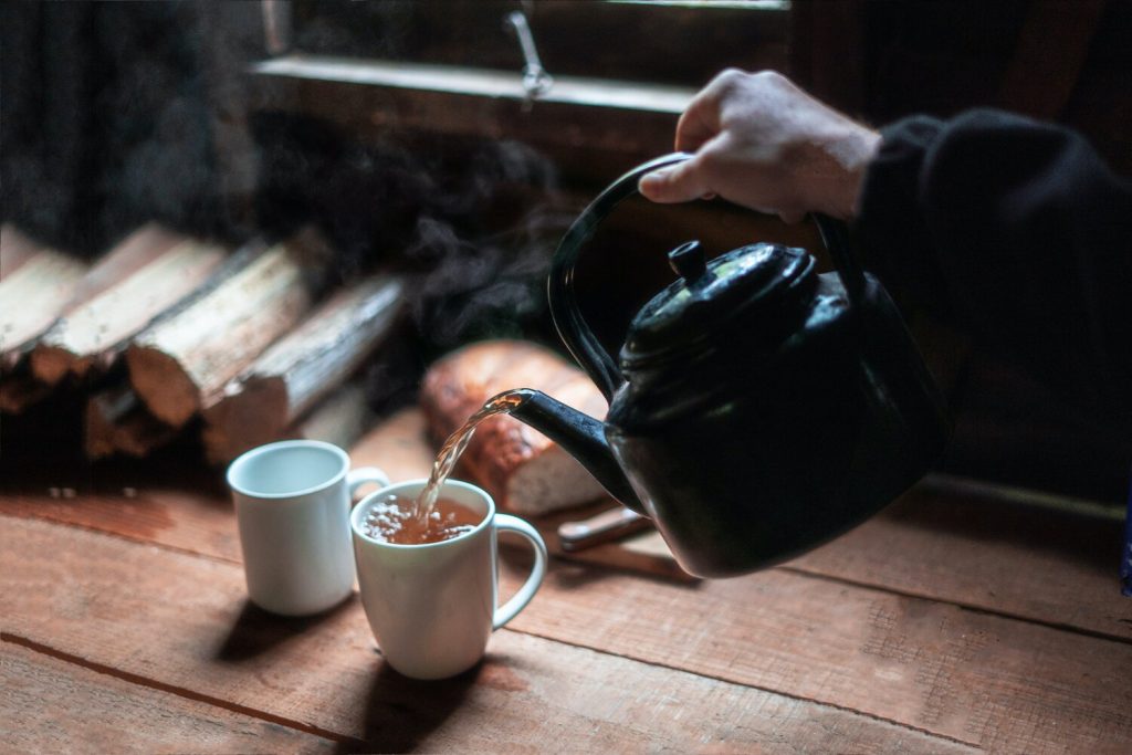 tea kettle, person pouring tea