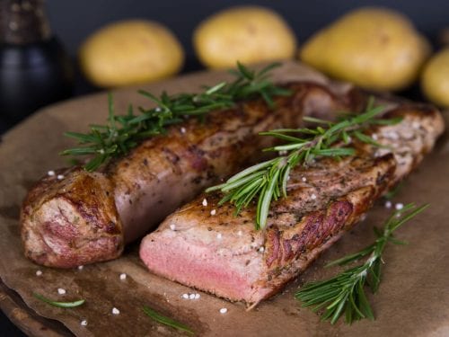 Sous Vide Pork Tenderloin Recipe, firm juicy medium rare pork loin sous vide with fresh herbs