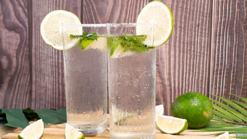 Mojitos Recipe, Mojitos served in tall glasses garnished with lime and mint leaves