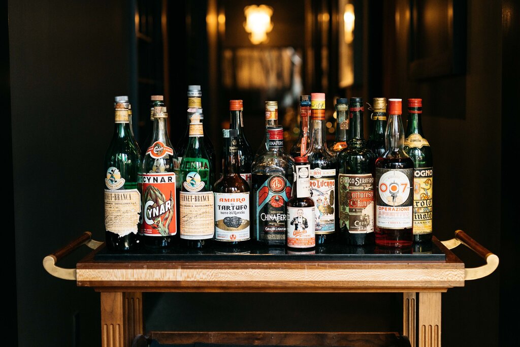 bar cart with wine bottles