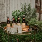 bottles of beer on a bar cart