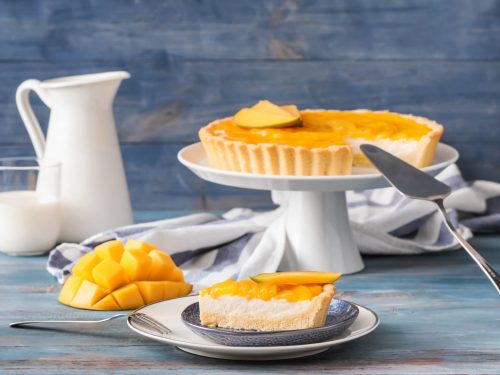 delicious mango pie on a wooden dessert stand