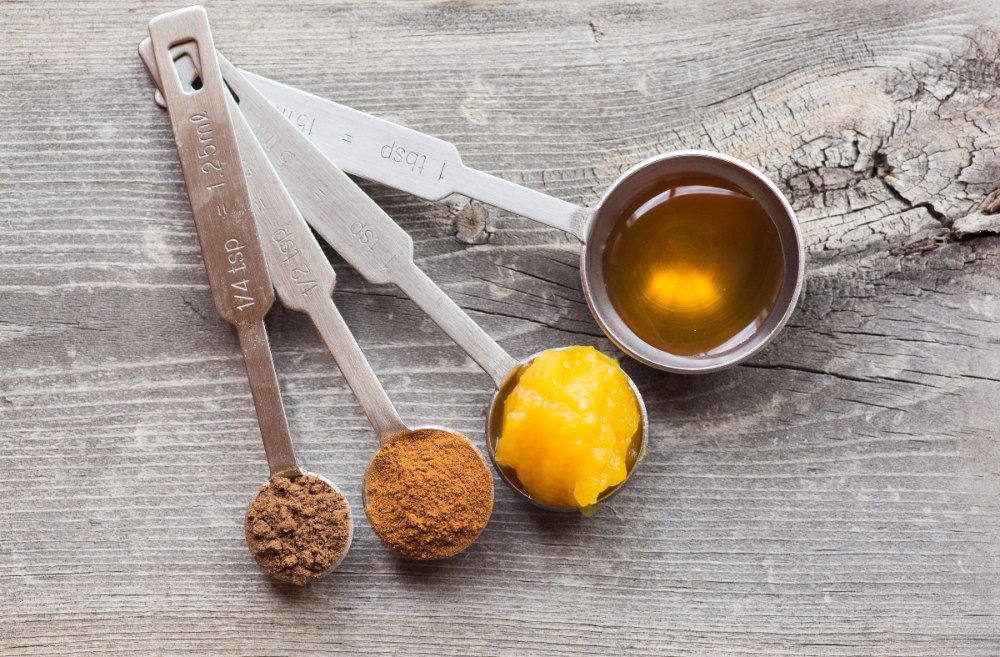 Metal measuring spoon with powdered and liquid ingredients, how many teaspoons in a tablespoon