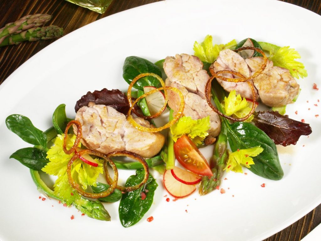 Plate of sweetbreads with vegetables