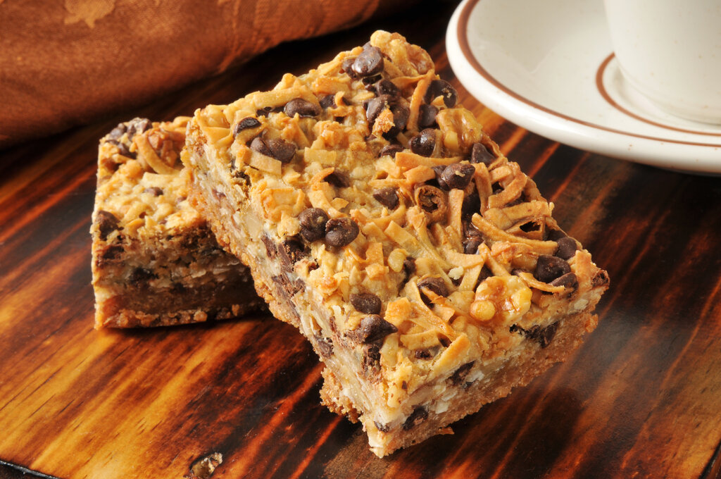 Hello Dolly Bars Recipe, dellicious dessert bars filled with chocolate chips, butterscotch chips, coconut, and walnuts, chunky magic cookie bars