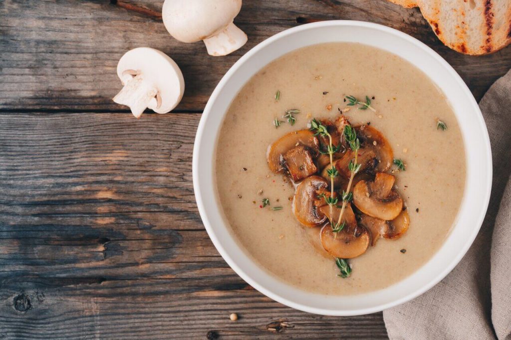 Gluten Free Cream of Mushroom Soup Recipe, a bowl of gluten free cream of mushroom soup with fresh mushrooms