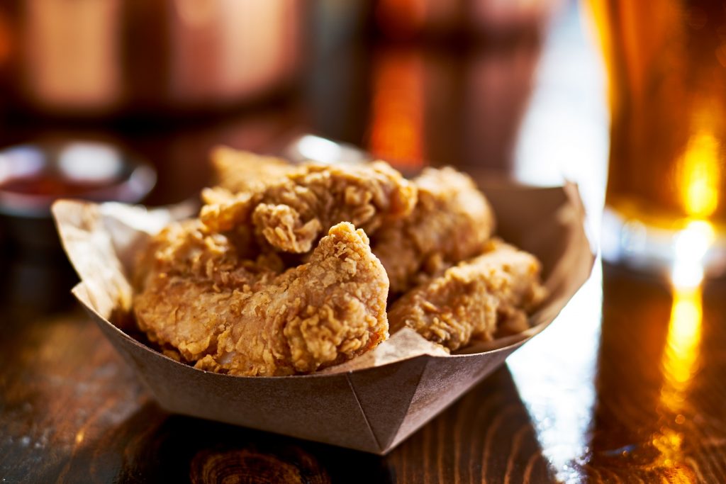 fried chicken tenders in paper basket