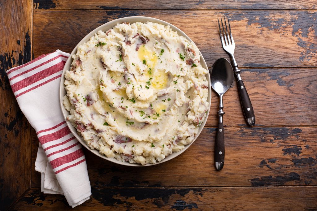 Traditional southern garlic mashed potatoes made with red potatoes skin on