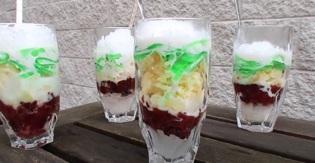 vietnamese three color dessert with a white background