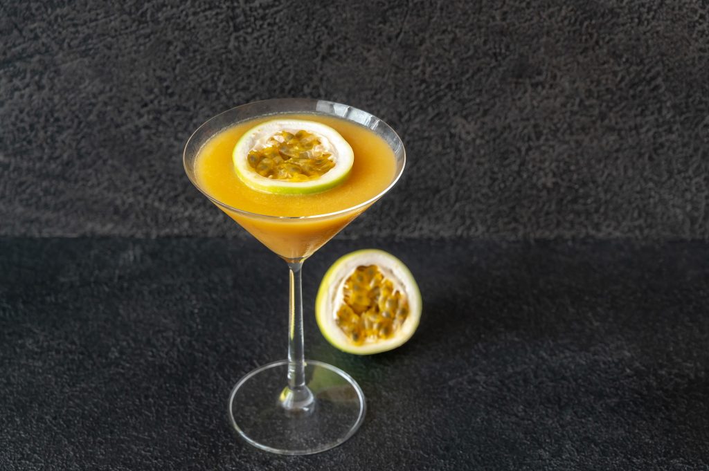 Pornstar Martini Recipe, Passionfruit cocktail topped with fruit slice