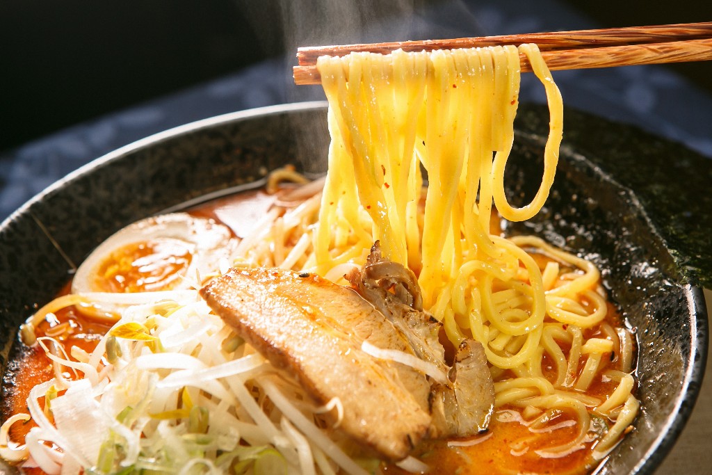 Bowl of Sapporo ramen, with chashu, bean sprouts, soft-boiled egg, and julienned scallions